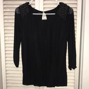 Black shirt with sheer sleeves, beads on shoulders